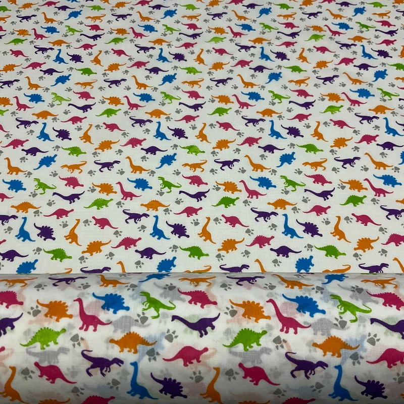 £2.50/m White Tiny Dinosaurs Children's Poly cotton printed fabric M1637