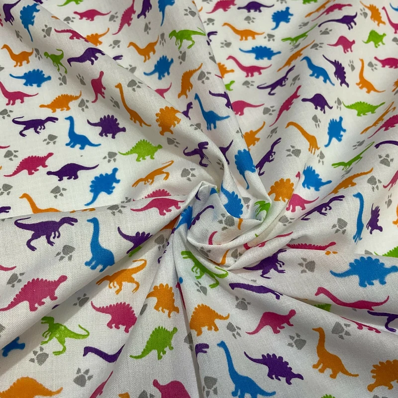 £2.50/m White Tiny Dinosaurs Children's Poly cotton printed fabric M1637