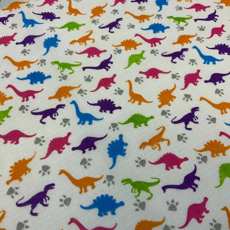 £2.50/m White Tiny Dinosaurs Children's Poly cotton printed fabric M1637