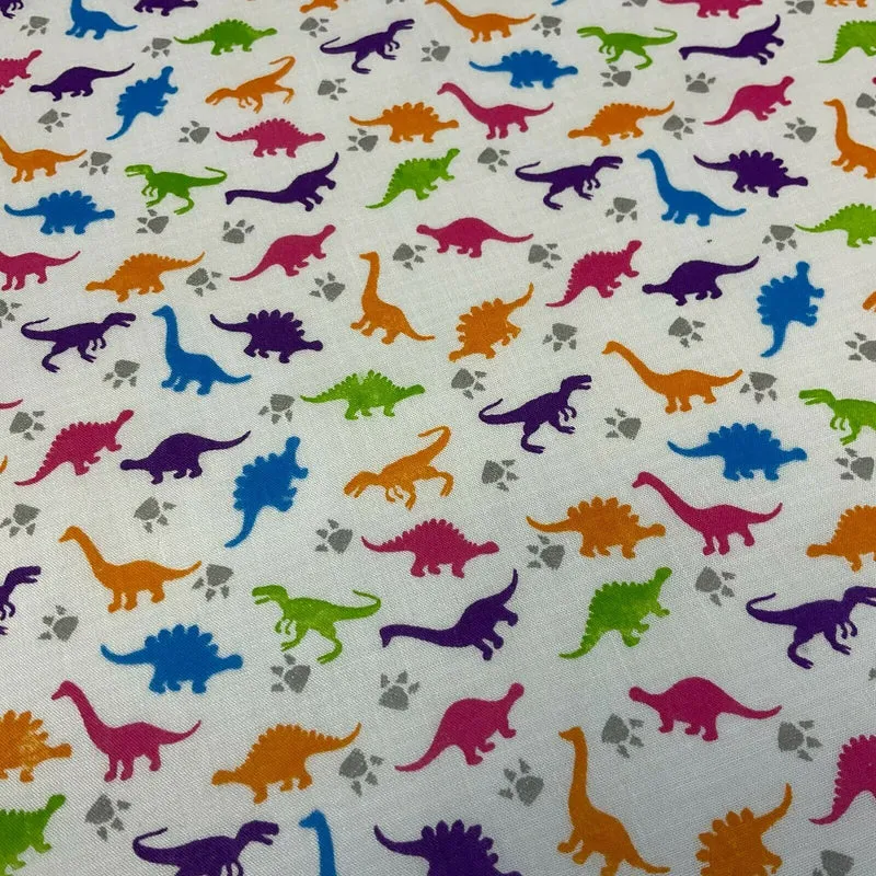 White Tiny Dinosaurs Children's Poly cotton printed lightweight fabric M1637