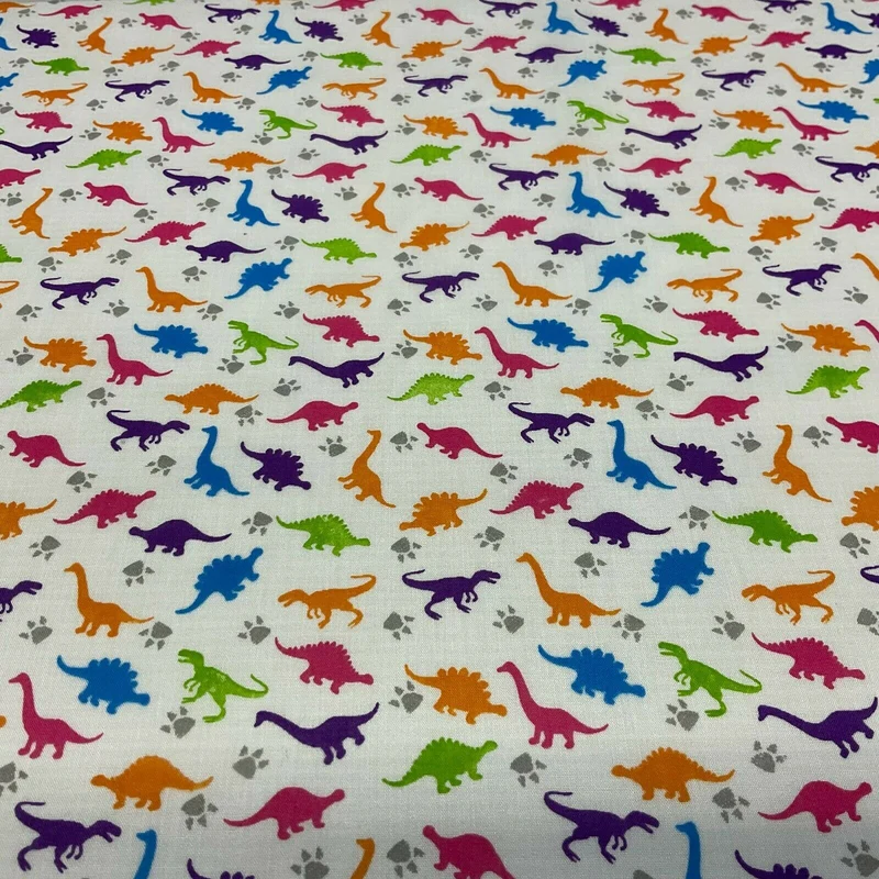 White Tiny Dinosaurs Children's Poly cotton printed lightweight fabric M1637