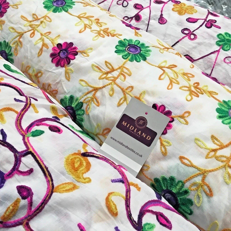 White Cotton with multicoloured wool embroidered dress fabric 54" Wide M1000