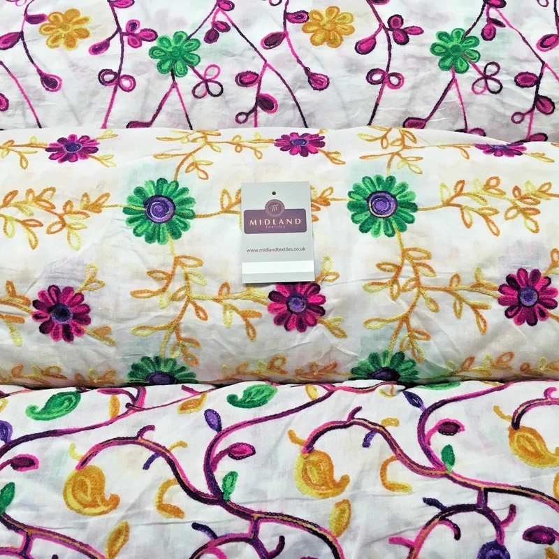 White Cotton with multicoloured wool embroidered dress fabric 54" Wide M1000