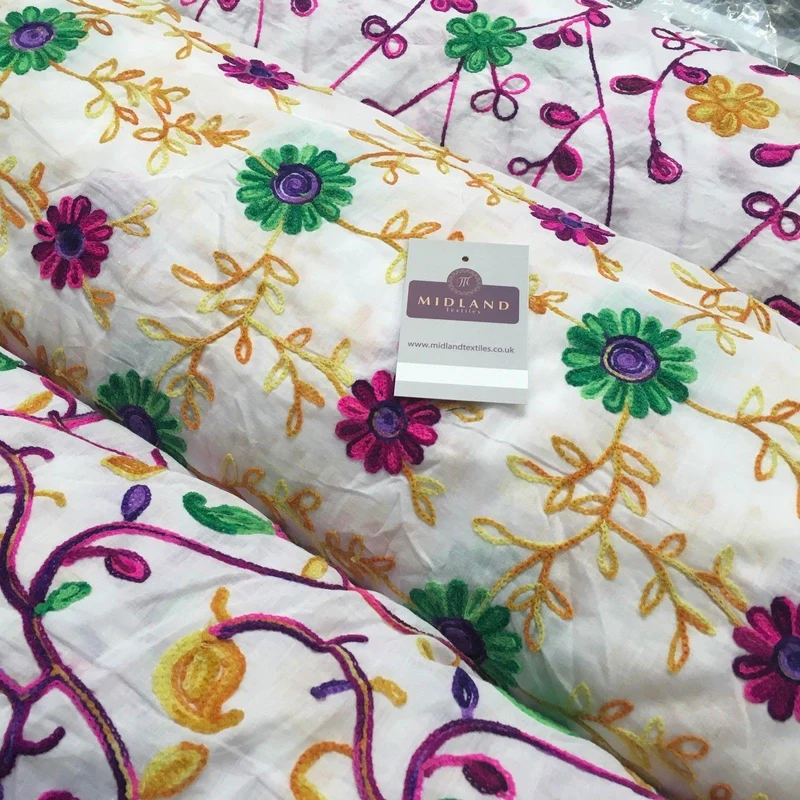 White Cotton with multicoloured wool embroidered dress fabric 54" Wide M1000